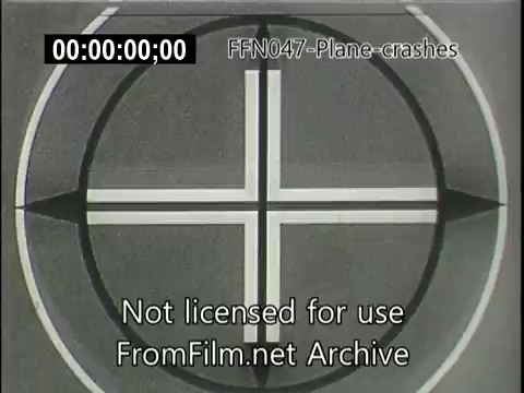 The still features a simple graphic design with a central cross pattern surrounded by concentric circles. It's likely a test pattern or visual marker used in film, indicating a transition or section of the newsreel related to plane crashes. The watermark at the bottom indicates that it is not licensed for use and is from an archive.