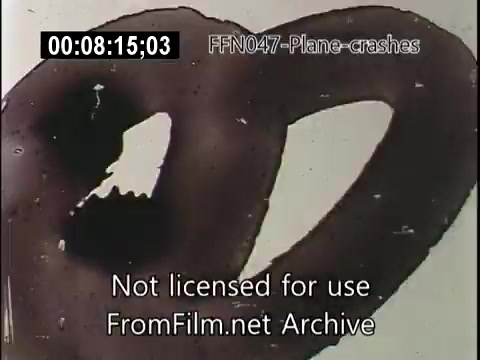The still appears to show a frame from a newsreel related to plane crashes. The image likely features abstract or damaged film elements, possibly indicating deterioration or visual effects rather than specific scenes. The overall context suggests a focus on aviation incidents, possibly presenting a dramatic or historical lens on such events.