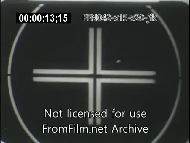 The still shows a black and white image with a prominent circular graphic featuring a cross pattern at its center. Overlaying the image is a timestamp and text indicating that the footage is not licensed for use and belongs to FromFilm.net Archive. The context relates to notable aerospace projects, potentially involving the X-15 rocket plane, the X-20 Dynasoar program, and events related to JFK.