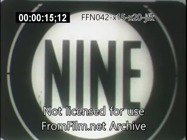 The still from the 16mm footage features a large, circular display with the number 'NINE' prominently shown in bold letters. The background is simple, emphasizing the number. The top of the frame includes a time code, along with a watermark indicating the footage is not licensed for use and its source from FromFilm.net Archive. The context suggests it may relate to a historical event involving the X-15 and X-20 space programs, as well as President JFK's involvement.