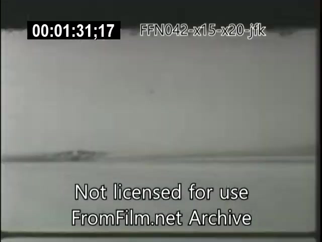 The still appears to show a frame from a 16mm film related to the X-15 and X-20 Dynasoar programs, possibly capturing a test flight or related event. The footage is in black and white, with a simplistic background suggesting a focus on an aircraft or space vehicle, likely highlighting significant aerospace advancements during the era of President JFK. The timestamp indicates it is part of a continuous sequence, and a watermark notes it’s not licensed for use.