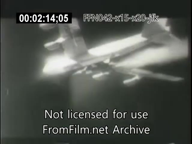 The still depicts a scene from a vintage 16mm film related to aerospace efforts, showcasing the X-15 or X-20 Dynasoar aircraft. The black and white footage highlights the craft in flight, emphasizing its design and technological aspects. Text at the bottom indicates the footage is not licensed for use and credits the FromFilm.net Archive. The timestamp suggests it's part of a longer sequence focused on aerospace advancements during the era, potentially relating to events involving JFK and aviation competitions like the Schneider Trophy.