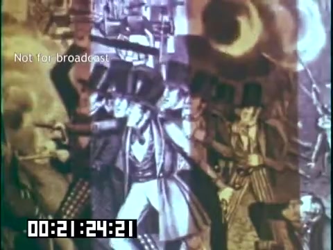 The still from 'Immigrant Heritage' featuring the Irish Rovers depicts a historical scene, showcasing figures in period clothing. The imagery suggests themes of immigration and cultural heritage, likely emphasizing the journey and experiences of Irish immigrants. The vibrant colors and dynamic composition may evoke a sense of storytelling or performance, characteristic of the film's educational intent.