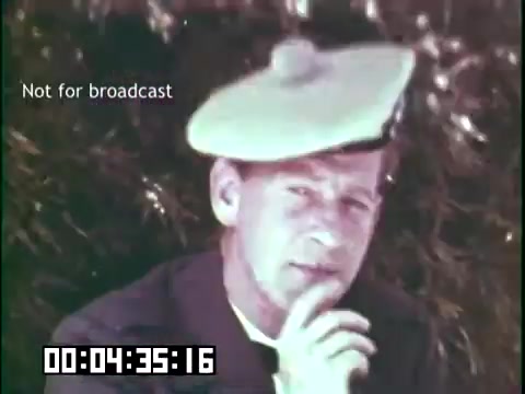 The still from 'Immigrant Heritage' features a man in a hat, thoughtfully resting his chin on his hand. He appears to be in a natural setting, suggesting a reflective or contemplative mood. The frame is marked 'Not for broadcast,' and a timestamp indicates it's part of a longer film segment. The overall tone is educational, aligned with the themes of heritage and immigration explored in the film.