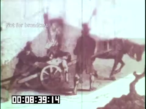 The still depicts a historical scene with figures and a horse-drawn cart, possibly representing immigrants' labor or daily life. The faded quality suggests it's from an older film, emphasizing the theme of 'Immigrant Heritage.' The presence of a timestamp and 'Not for broadcast' indicates it's a behind-the-scenes or archival clip related to the Irish Rovers and their exploration of cultural roots.