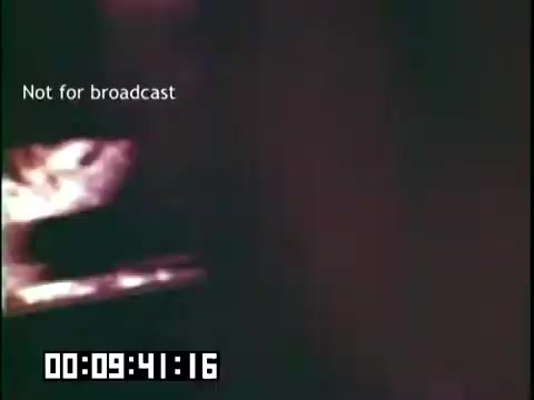 The still from 'Immigrant Heritage' features a dimly lit scene, possibly depicting elements related to Irish culture or heritage. The text 'Not for broadcast' indicates that this material is intended for private or educational use only. The timecode suggests this is a moment from the film, emphasizing its archival nature. The focus may be on storytelling or cultural representations, typical of the themes explored by the Irish Rovers.