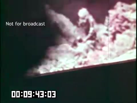 The still from 'Immigrant Heritage' features a muted color palette, showcasing a scene possibly related to the themes of Irish culture or immigration. The text 'Not for broadcast' indicates that this image is intended for internal use or review. The timestamp suggests it's part of a longer sequence, likely emphasizing moments that highlight the immigrant experience, narrated or accompanied by music from the Irish Rovers. The visual composition may include natural or cultural elements, typical of educational films aimed at preserving heritage.