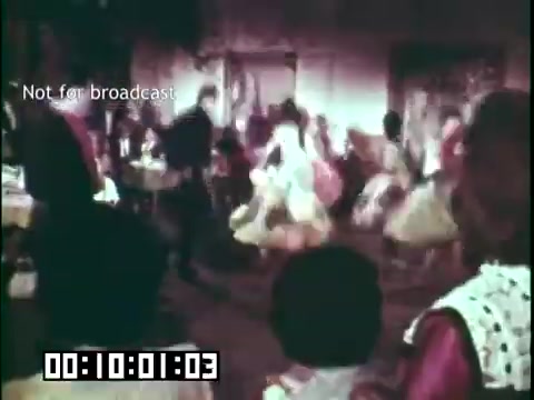 The still from 'Immigrant Heritage' features a lively scene likely depicting traditional dance or cultural celebration, with participants in vibrant clothing and dynamic movement. The background suggests a festive atmosphere, possibly highlighting Irish cultural elements. The text 'Not for broadcast' indicates that this is a behind-the-scenes or archival clip, and a timestamp is shown at the bottom.