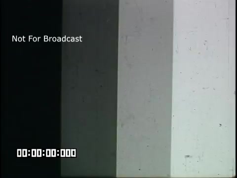 The still features a color test pattern with segments ranging from black to white, indicating various shades of gray. The left side is black, transitioning through lighter shades to the far right, which is white. The overlay text reads 'Not For Broadcast,' suggesting it's a technical or preview segment rather than the main content. A time code appears at the bottom.