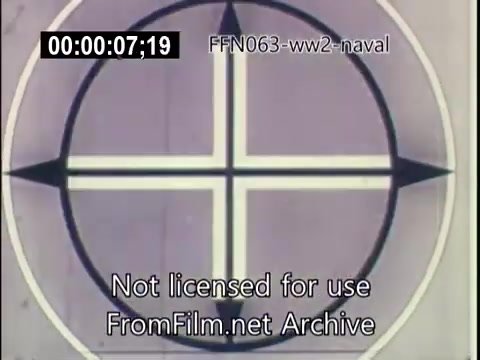 The still features a circular target graphic, possibly representing a naval targeting or bombing crosshair. The image is part of US Naval footage from World War II, specifically focused on kamikaze attacks. The text overlaid suggests it is not licensed for use and is from the FromFilm.net Archive. The colors appear muted, reflecting the historical era of the footage.
