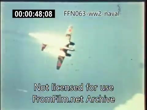 The still from 'US Naval footage - World War 2 - kamikaze attacks' shows an aircraft, likely a Japanese Zero, descending with smoke trailing behind it. The plane appears to be engaged in a kamikaze attack, highlighting the intense aerial combat of the era. The timestamp indicates a moment capturing the critical action of World War II, emphasizing the dangers faced by naval forces.