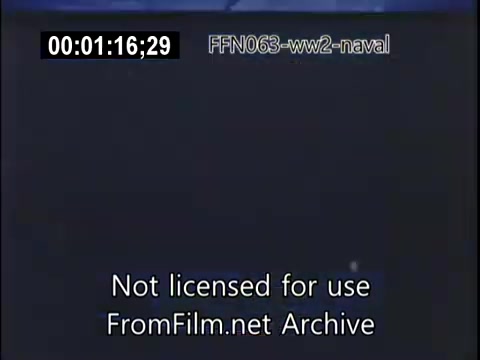 This 16mm still from 'US Naval footage - World War 2 - kamikaze attacks' likely depicts a moment captured during intense naval operations involving kamikaze attacks, where enemy aircraft targeted US naval vessels. The footage is intended to document the challenges faced by the Navy during this period of conflict. It is part of a larger historical narrative focusing on military engagements in the Pacific theater.