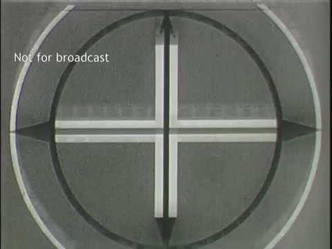 The still features a test pattern typically used in television and film, characterized by concentric circles and intersecting lines. The text 'Not for broadcast' indicates that this image is not intended for public viewing. This type of display often precedes a film or program, suggesting a technical or preparatory phase before actual content is shown. In the context of 'Assorted news footage of plane crashes,' it serves as an introductory visual to a collection of distressing news items.