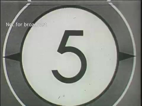 The still features a vintage film countdown, prominently displaying the number '5' in a bold, simple font against a circular background. The countdown is typical of mid-20th century film presentation, likely indicating the start of a news segment related to plane crashes. The fade into the next footage suggests an imminent transition to more serious content. The message 'Not for broadcast' implies the footage is meant for internal use or archival purposes.