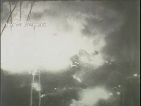 The still from the 16mm footage depicts a chaotic scene of an aircraft crash, characterized by an explosion and billowing smoke. The image captures the aftermath, showing debris and fire, emphasizing the destructive impact of the incident. This archival footage illustrates the gravity and tragedy associated with plane crashes, likely serving as part of a news report. The watermark indicates it is not for broadcast.