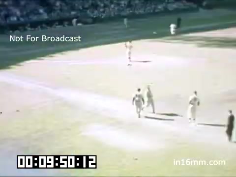 The still captures a moment from a Detroit Tigers game at Briggs Stadium, dated between 1948 and 1950. The scene is characterized by vintage Kodachrome colors, displaying players on the field. The image features a pitcher, some teammates, and an umpire, with a crowd visible in the background. A timestamp at the bottom indicates the footage duration, and a 'Not For Broadcast' label suggests it's archival material. The overall atmosphere reflects the mid-20th century American baseball experience.