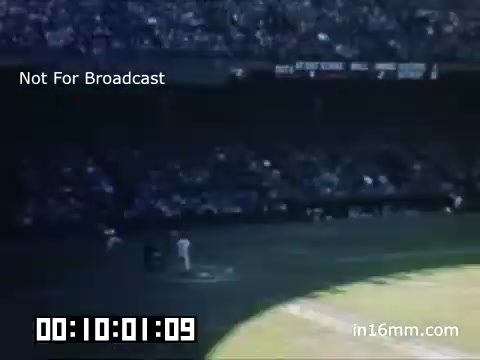 The 16mm still from the 'Briggs Stadium Detroit Tigers footage - 1948-1950' shows a vibrant scene from a baseball game at Briggs Stadium. The image captures the field with players in action, and a sizeable crowd fills the stands, highlighting the mid-century atmosphere of the era. The colors are vivid, characteristic of Kodachrome film, reflecting the lively environment of a Tigers game. A timestamp in the corner indicates the footage's duration, suggesting it is part of a longer clip. The label 'Not For Broadcast' signifies that this is likely archival material not intended for commercial airing.