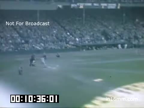 The still features a scene from a Tigers game at Briggs Stadium during the late 1940s to early 1950s. Viewers can see players on the field, with a large crowd in the stands. The image is tinted with the vintage quality of Kodachrome film, capturing the atmosphere of a mid-century baseball game. Text indicates it is not for broadcast, and a timestamp is displayed at the bottom.