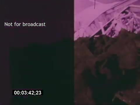 The still from the 'Sikorski S-76 Promotional Film' features a divided frame, with the left side displaying a text overlay stating 'Not for broadcast.' The overall color palette leans towards purples and blacks, suggesting a stylized presentation. The right side shows what appears to be a textured image, possibly depicting parts of the Sikorski S-76 helicopter or related materials. The timestamp at the bottom indicates the specific moment in the footage, but without any audio, the impact relies solely on the visual elements presented.