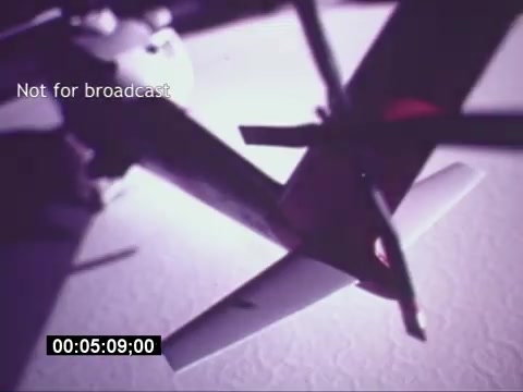 The still from the 'Sikorski S-76 Promotional Film' features a close-up view of the helicopter's rotor assembly. The image is moody and stylized, likely highlighting the mechanics and engineering of the Sikorsky S-76. The text overlay 'Not for broadcast' suggests it is a behind-the-scenes or promotional piece intended for internal use rather than public distribution. The timestamp indicates it's part of a longer sequence, showcasing a specific moment at around 5 minutes into the film. The overall feel is technical and focused on showcasing the helicopter's features.
