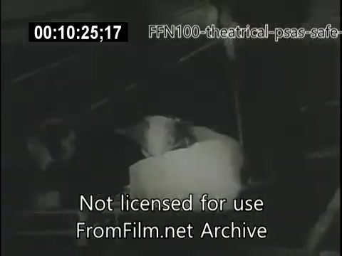 The still from the 1949 theatrical public service announcements for safe driving likely features a scene emphasizing the consequences of dangerous driving. It may include stark imagery, such as a vehicle accident or individuals in distress, showcasing the importance of road safety. The overall tone is likely serious, aimed at raising awareness about the risks associated with reckless driving behaviors.