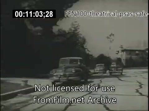 The still features a black-and-white scene showing multiple vintage cars driving along a cracked road, highlighting the road conditions of the time. This image is part of a 1949 public service announcement aimed at promoting safe driving practices. The visual context suggests an emphasis on road safety amid potential hazards.