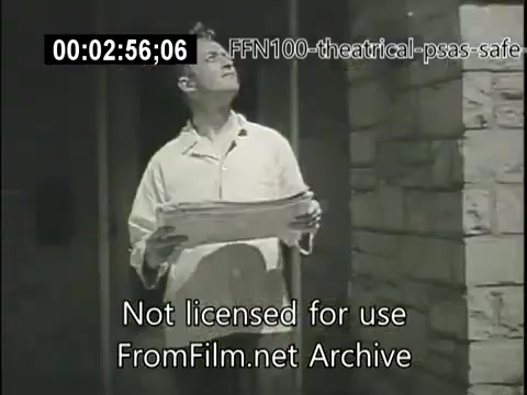 The still from the 1949 theatrical public service announcements for safe driving features a man holding a piece of paper, looking upwards. He appears contemplative in a dimly lit space with stone walls, likely setting a serious tone for the messaging around safe driving. The image is notably from a historical context, reflecting post-war public service efforts.