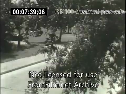 The still depicts a black-and-white scene likely from a 1949 public service announcement focused on safe driving. The setting appears to be a residential street, framed by trees, with parked cars visible. The film is part of a theatrical PSA series created to promote road safety during that era. The watermark and timecode indicate it's not licensed for use.