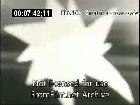 The still shows a bright, star-like graphic, likely used to emphasize key messages in a 1949 public service announcement on safe driving. The monochrome contrast suggests a vintage style typical of that era. The text overlay indicates the source is FromFilm.net Archive, and it is marked as not licensed for use. Overall, the image captures the retro aesthetic of mid-20th century film promotions.