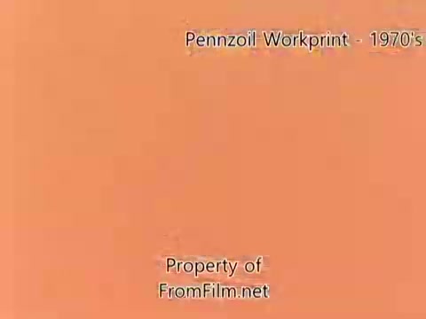 The still features a plain orange background with the title 'Pennzoil Workprint - 1970's' displayed prominently. It indicates that the content is a workprint from a Pennzoil refinery project from the 1980s, with a note about the presence of debris in the film gate. Additionally, the property rights are attributed to FromFilm.net. The accompanying music includes tracks by Underbelly, contributing to the overall atmosphere of the film.