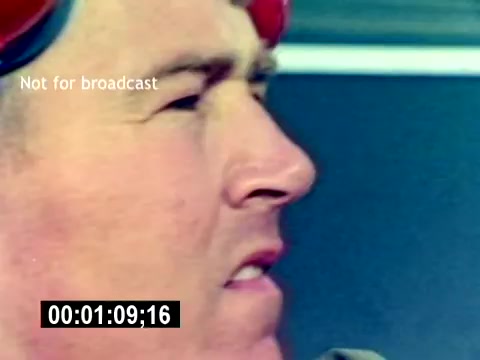 The still from the 'USMC Aviation Ordnance Recruiting Film - Silent' features a close-up of a man, likely a Marine, with a focused expression. He is wearing a helmet or headgear, suggesting he is in a military or aviation context. The timing marker indicates the film is 1 minute and 9 seconds in. The image has a vintage look, typical of 16mm film. The 'Not for broadcast' label indicates that it’s for internal use or archival purposes.