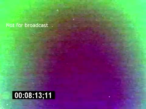 The still from the 'USMC Aviation Ordnance Recruiting Film - Silent' displays a visually distorted frame with vibrant green and purple hues. The text 'Not for broadcast' is visible, indicating it's intended for restricted viewing. A timestamp appears at the bottom, showing the duration of 8 minutes and 13 seconds. The overall quality suggests an older film format, typical of 16mm footage.