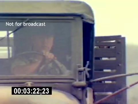The still depicts a close-up of a military truck, with a focus on a driver, presumably a USMC personnel. The background suggests an outdoor setting, likely a training area. The image is part of the 'USMC Aviation Ordnance Recruiting Film - Silent,' which emphasizes military operations. The timestamp indicates it's 3 minutes and 22 seconds into the film, and a label states it is not for broadcast.