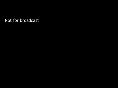 The still features a black background with the text 'Not for broadcast' prominently displayed. This indicates the film is likely intended for internal or educational use rather than public airing. The film, 'IBM - The Information Center,' showcases the application of IBM's 1960s computer technology, such as punch cards, to manage educational tasks like grades and course enrollment.