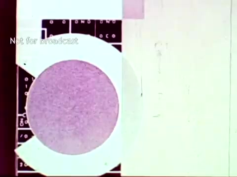 The still from 'IBM - The Information Center (1963)' features a visual collage incorporating elements of IBM's technology, such as punch cards and abstract shapes. A prominent circular shape overlays a grid background, suggesting a focus on data processing and organization. The text 'Not for broadcast' indicates the film's intended private context. Overall, the image reflects the era's innovative approaches to educational administration through computer technology.