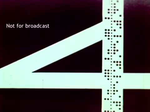 The still features a large, stylized number '4' prominently displayed, accompanied by a series of punch card holes alongside it. The text 'Not for broadcast' is visible, suggesting that this is a segment from an educational film rather than a public broadcast. This imagery reflects IBM's focus on using technology, specifically punch cards, to manage educational data such as grades and enrollments in the early 1960s. The overall aesthetic has a retro, technological vibe characteristic of the period.