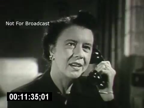 The still features a woman speaking on the telephone, captured in a moment of engagement and expression. The setting has a vintage aesthetic, reflecting the era of the film, with subdued tones and a classic design. This scene likely highlights the importance of communication in the narrative of 'Bell System - Story Without End.' The timestamp indicates it's about 11 and a half minutes into the film.