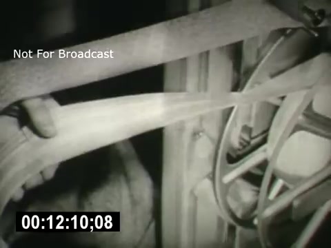 The still from 'Bell System - Story Without End' features a close-up of mechanical equipment, showcasing intricate machinery and components in motion. The image has a monochrome aesthetic typical of vintage films. The timestamp in the corner suggests it is a specific moment within the film, while the 'Not For Broadcast' label indicates that this material is restricted for public viewing. Overall, it captures the industrial essence of the Bell System's technological narrative.