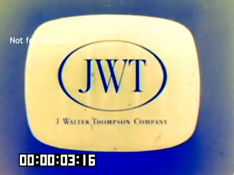 The still features a vintage logo for 'JWT' (J. Walter Thompson Company) presented on a softly colored background. The logo appears within an oval shape, emphasizing its branding from the era. A timestamp indicates the start of the film, and there's a 'Not for distribution' watermark, suggesting the material is proprietary. The overall aesthetic reflects the distinct visual style of the late 1970s.