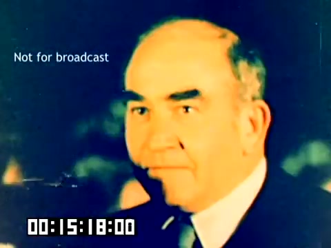 The still features a middle-aged man with a serious expression, presumably a speaker or participant from the Kodak sales film. The image is slightly blurred with a retro color palette typical of the 1970s, and a watermark that reads 'Not for broadcast.' A timecode at the bottom indicates the film's progress. The overall ambiance suggests a promotional or informative context related to Kodak's products during that era.