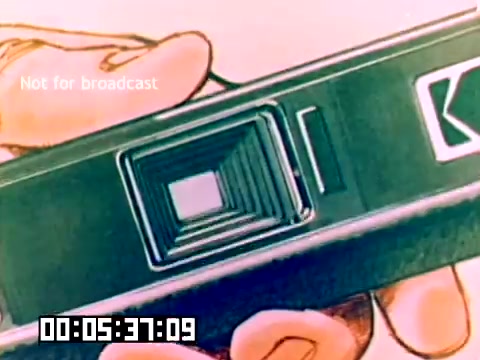 The still depicts a close-up of a Kodak camera, showcasing its lens and body design. A hand is prominently featured, suggesting that the camera is being held and perhaps presented. The imagery has a colorful, stylized quality, typical of 1970s marketing. The text 'Not for broadcast' appears in the corner, indicating its intended purpose as private sales material. A timecode is also visible at the bottom, marking the elapsed duration of the film. The overall aesthetic reflects the retro charm of the era's promotional content.