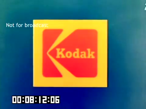 The still features the iconic Kodak logo displayed prominently against a blue background. The logo consists of a stylized 'K' and the word 'Kodak' in white. The image includes a timestamp in the lower left corner, indicating the duration of the film, and the text 'Not for broadcast' appears in the upper left corner, suggesting it is meant for internal use or presentation rather than public airing. This still captures the essence of marketing and branding from the late 1970s.