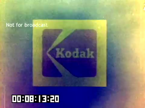 The still features the Kodak logo prominently displayed, with a colorful and slightly faded appearance suggestive of vintage film. The text 'Not for broadcast' is visible, indicating that the film was intended for internal use or specific presentations. A timecode is also present at the bottom, showing a playback duration of 8 seconds and 20 frames. Overall, it captures a nostalgic look at film advertising from 1977 without audio.