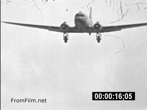 The still from *Your Man In Vietnam* features a CH-54 helicopter descending against a cloudy sky, showcasing the aircraft's significant role in the Vietnam War. This public service announcement highlights the experiences of U.S. Army personnel, particularly Specialist 6 James Daly, emphasizing the challenges and realities faced by service members during this era. The image captures the essence of military life and operations in a historical context, serving as a poignant reminder of the Vietnam War's impact on soldiers.