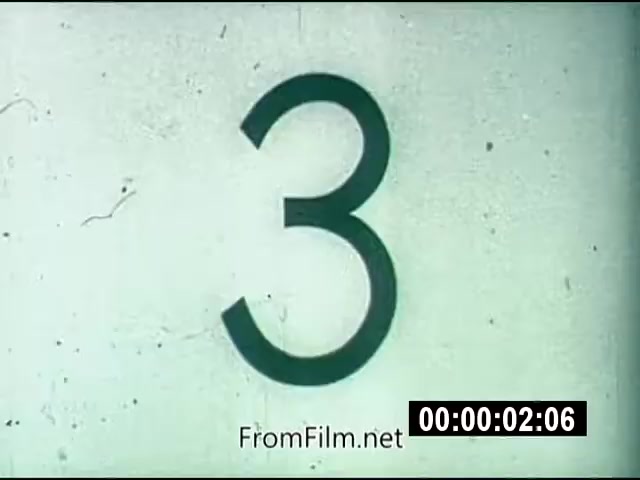 The still shows a countdown number '3' prominently displayed on a textured background, typical of archival footage from the 1970s. This countdown likely serves as an introduction to the 'Energy From Space' segment. The film is characterized by its silent color format, indicating the presentation style of educational or news footage from that era. The timestamp suggests the beginning of a short segment related to energy transmission from space, possibly illustrating concepts of solar energy or space technology.