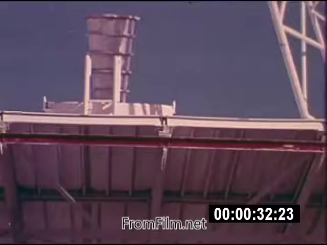 The 16mm still from 'Energy From Space' depicts a viewpoint focused on a structure, possibly related to energy reception or transmission. The film is characterized as color and silent, with a run time of 1:46, created in September 1976. The footage is part of actuality material sent to a West Virginia TV station, highlighting early concepts of capturing energy from space. The visual suggests a technological endeavor related to solar or space energy.
