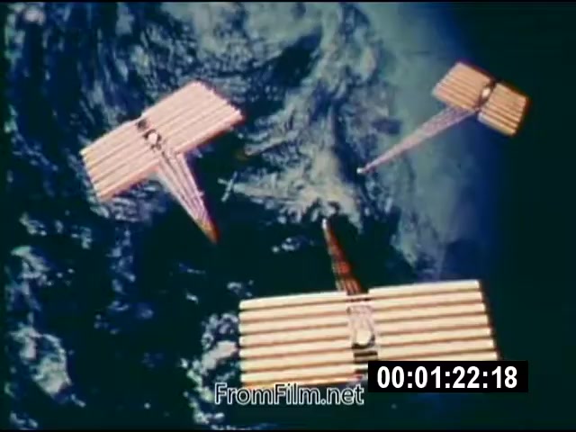 The still depicts a sequence from the 16mm film 'Energy From Space,' showcasing conceptual models of energy collection devices in space, designed to harness solar energy. The imagery features three large, rectangular structures with alternating red and white stripes, seemingly floating against the backdrop of Earth. The footage, dated September 1976, emphasizes NASA's exploration of renewable energy sources from outer space, with a runtime of 1:46. It is part of actuality footage sent to a West Virginia TV station. The presentation is silent but marked as a significant exploration of energy transmission concepts.