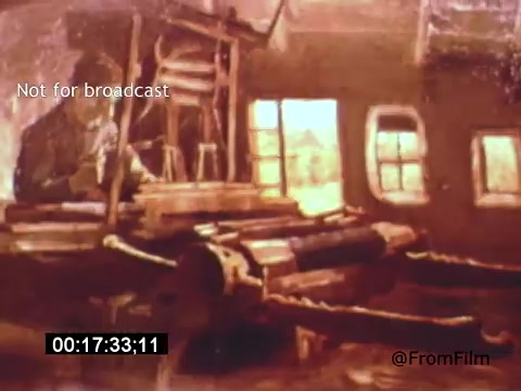 The still from 'Vincent Van Gogh: A Self-Portrait' (1961) features a softly lit, rustic interior scene. It showcases an artist at work, surrounded by art supplies and tools, evoking the atmosphere of Van Gogh's creative environment. The warm tones and blurred details suggest a dreamy, reflective quality, fitting for a portrayal of the renowned painter. The presence of Lee J. Cobb provides a narrative depth, likely reflecting on Van Gogh's life and struggles.