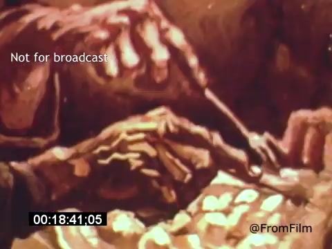 The 16mm still from 'Vincent Van Gogh: A Self-Portrait' (1961) depicts a close-up of hands engaged in painting, likely reflecting Van Gogh's artistic process. The image conveys a sense of intimacy and focus, emphasizing the creative act. The color palette appears rich and warm, adding to the emotional depth of the scene. Lee J. Cobb's narration likely complements this visual, enriching the portrayal of Van Gogh's life and artistry.