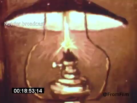 The still from 'Vincent Van Gogh: A Self-Portrait' (1961) features a close-up of a vintage lantern. The warm light emanating from the lantern creates an inviting glow, illuminating the surrounding area. The ambiance suggests a sense of introspection, capturing the essence of Van Gogh's contemplative nature. The film, narrated by Lee J. Cobb, explores the artist's life and works, enhancing the visual narrative with the historical warmth of the 16mm format.